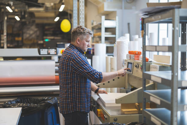istock Man working in a printing factory 2155612182