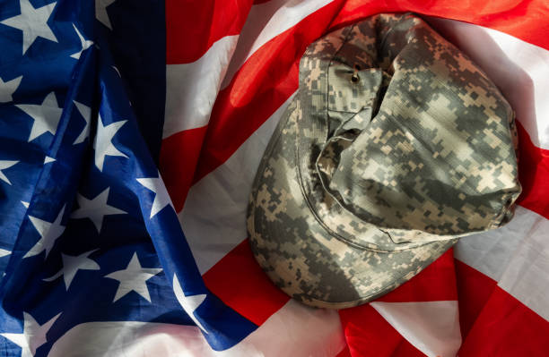 istock US Army helmet and dog tag on US flag background 2155616442