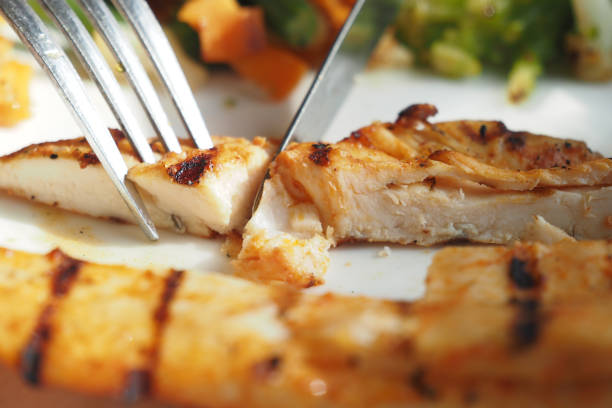 istock cutting grill chicken meat with knife 2155616501