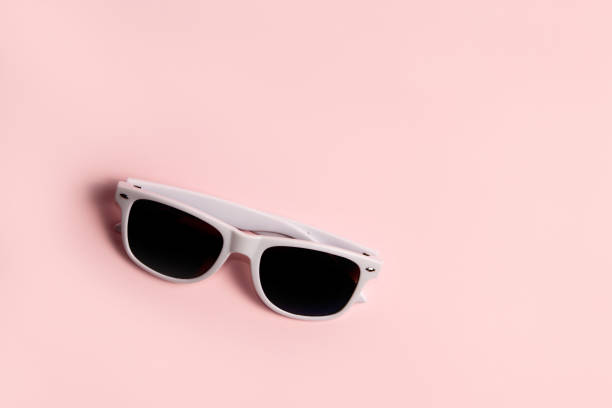 Sunglass On White Sand Beach on White Background