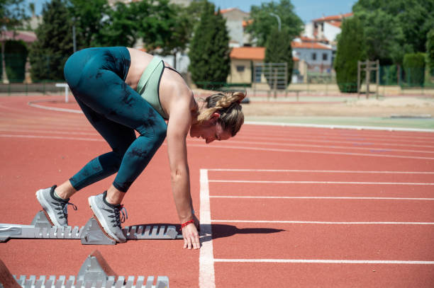 istock Female athlete in starting position on a track 2155618853