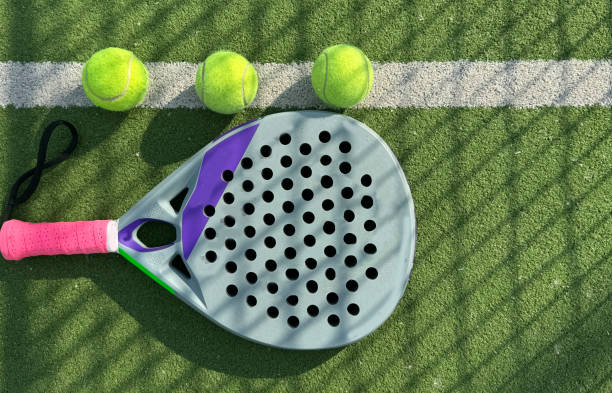istock paddle tennis racket and balls on court 2155619066