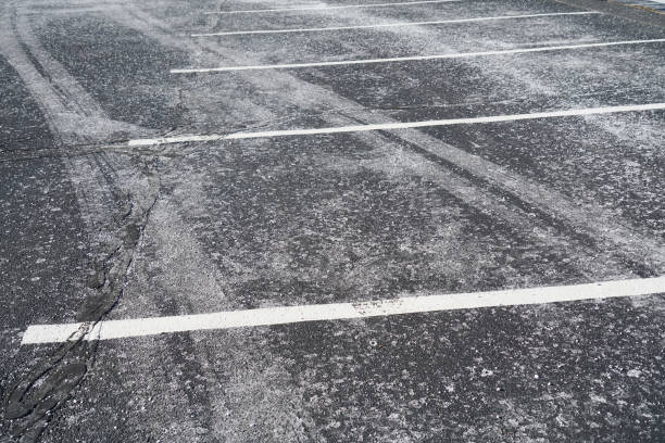 istock close up on parking lots with salt before snow in winter 2155621164