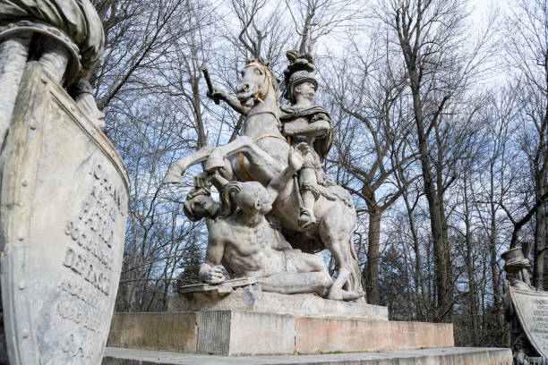 10.03.2024 Warsaw, Poland. The Monument to Jan III Sobieski with green trees on a sunny day at Lazienki Park in Warsaw, Poland. It was designed by André Le Brun, the court sculptor of King Stanisław August, and the contractor was Franciszek Pinck. The monument was ceremoniously unveiled on September 14, 1788, on the 105th anniversary of the victory at Vienna.