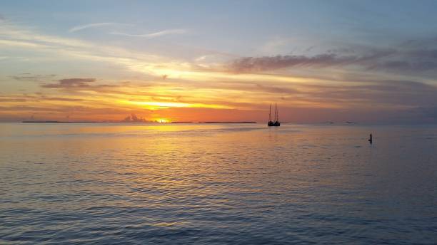 istock Two sailboats in Florida Bay at sunset. 2155624554