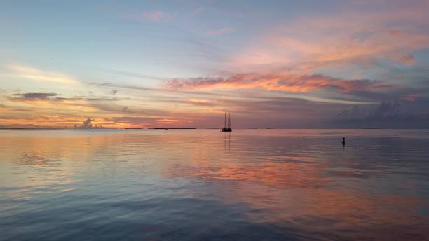 istock Two sailboats in Florida Bay at sunset. 2155624585