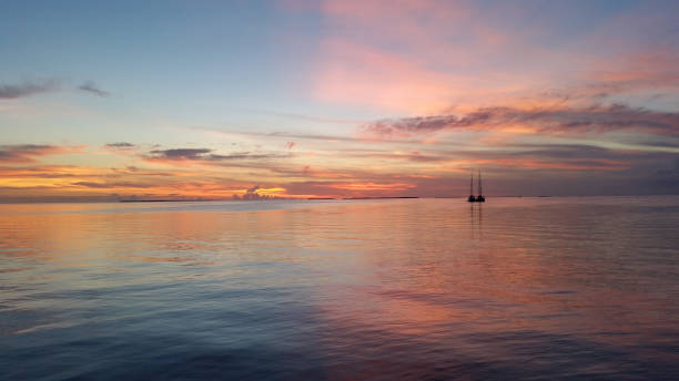 istock Two sailboats in Florida Bay at sunset. 2155624602