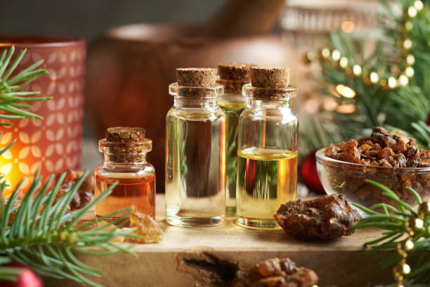 istock Christmas essential oils with myrrh, frankincense and spruce tree branches 2155624703