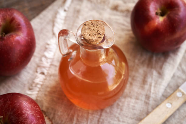 istock Fresh apple cider vinegar in a glass jug 2155625539