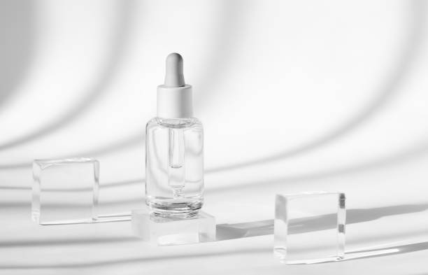 istock clear serum bottle with crystal blocks and shadows 2155629861