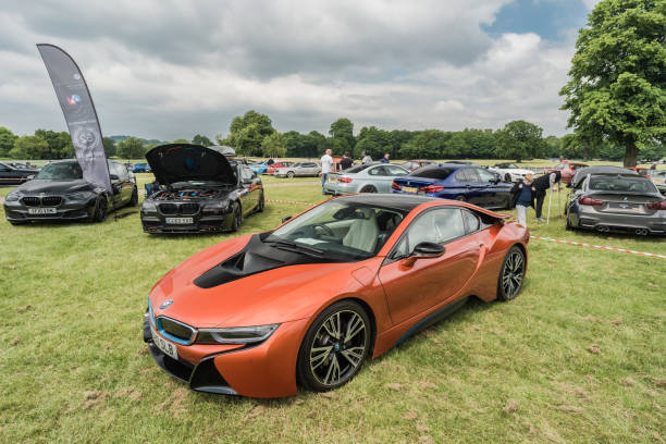 Tarporley, Cheshire, England, June 1st 2024. An orange BMW i8 is displayed at a car meet.