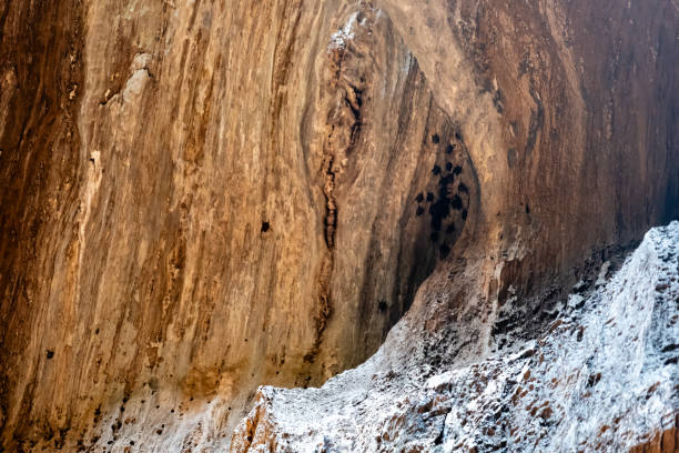 Step into the sunbeam-kissed heart of this majestic cave, where time stands still and adventure beckons.