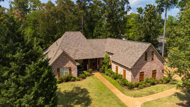 istock Suburban house with newly installed shingles 2155632371