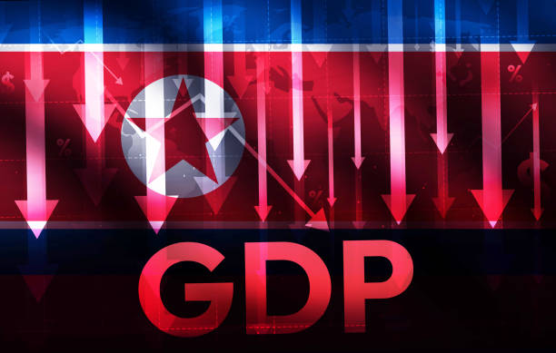 istock North Korea GDP going down with arrows and flag waving in the backdrop. 2155632410