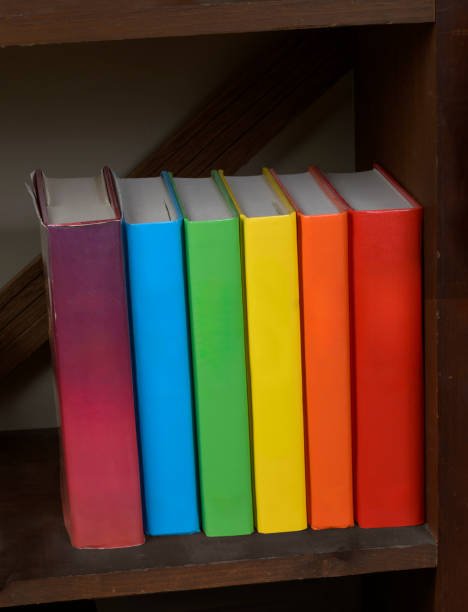 istock Row Of Multicolored Hardbound Books With Blank Spines 2155634413
