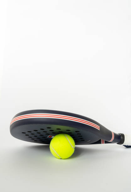 istock blue professional paddle tennis racket with yellow ball on white background. copy space for text 2155636817