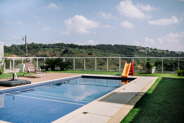 Creating a Big Splash,an Inflatable Mattress Floats in a Pool During Sunset,Surrounded by a Stunning Landscape That Highlights the Beauty of Summer Evenings