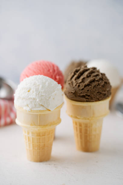 istock vanilla, chocolate, strawberry ice creams on cone 2155642685