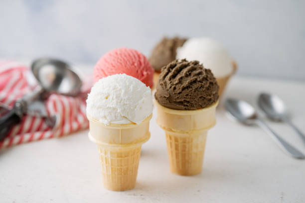 istock vanilla, chocolate, strawberry ice creams on cone 2155642808