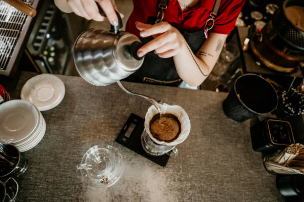 istock professional female barista preparing filter coffee 2155643032