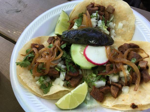 istock Tongue tacos with cucumber and radish. 2155645352