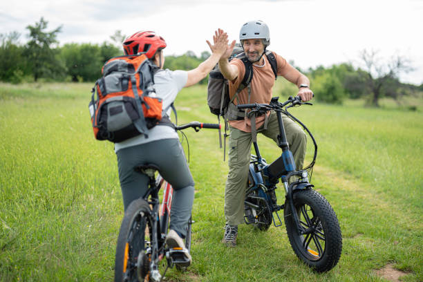 istock Bicyclists High-Five. Biking Adventures in Nature. 2155653009