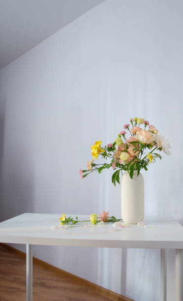 istock beautiful bouquet in white vase in sunlight 2155653117