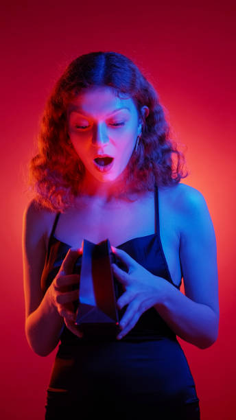 istock Surprise gift party present neon astonished woman 2155653146