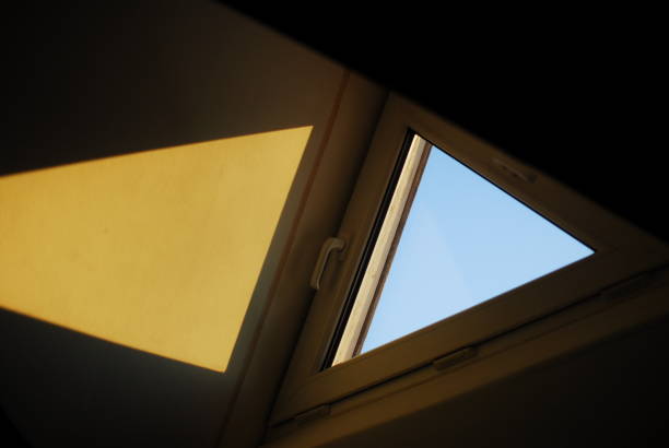 istock Sky through a window with a yellow triangle in the middle 2155655848