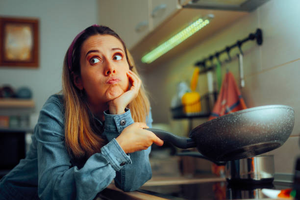 istock Bored Woman Cooking at Home Feeling Unhappy 2155658086