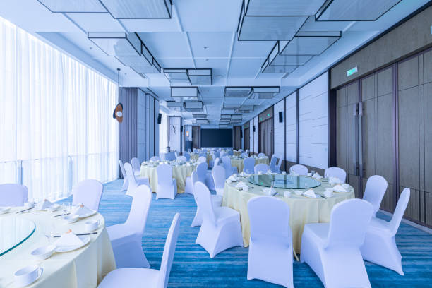 istock An upscale, elegant banquet hall restaurant with blue color tones. 2155666209
