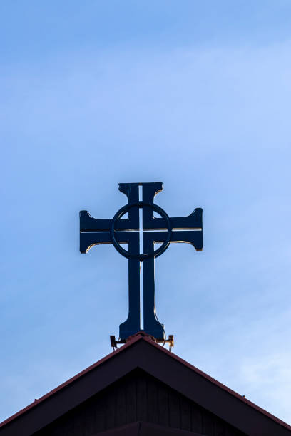 Religious cross over bell tower