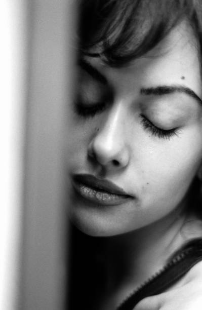 istock Head-shot of relaxed woman in a black & white image. 2155669068