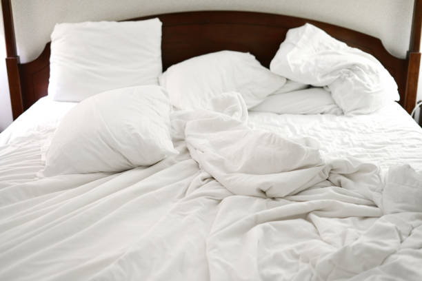 istock close up on messy quilt on the bed 2155670370