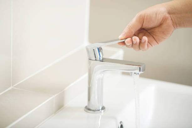 istock Turn on-off the faucet to save on water bills 2155672605
