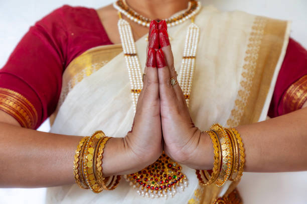Female Indian classical dancer in Bharatanatyam dance mudra on white background with copy-space.