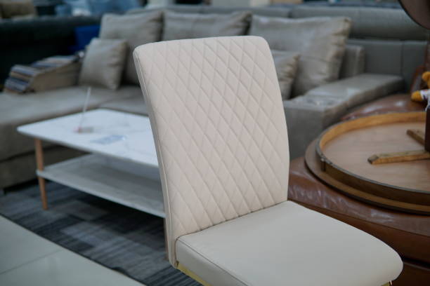istock Luxury Marble stone top dining table and chairs set with golden color metal base and frame. Luxurious Dining set. Details of close up of chair and frame of table. 2155674844