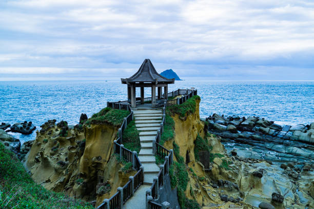 istock A small wooden pavilion is on a rocky cliff overlooking the ocean 2155677929