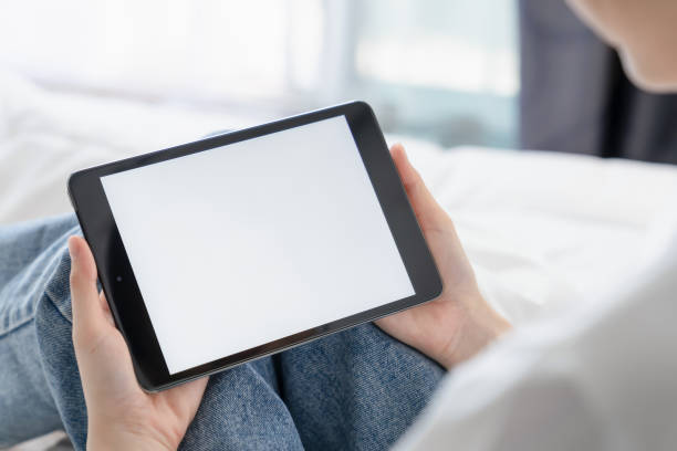 istock Hand holding digital tablet mockup of blank screen for graphic display montage. 2155679424