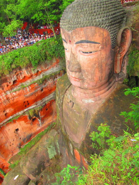 The Giant Sitting Buddha Statue of Leshan, China is a captivating historical landmark of the region. It's 71-metres tall (233 ft) and was built between 713 and 803 AD.  The statue is one of the largest Buddha statues in the world and experiences a great amount of tourism annually. Visitors can view the statue from the top of the mountain, take stairs down to ground level, and catch a scenic cruise that props visitors right in front of it. What a marvel!