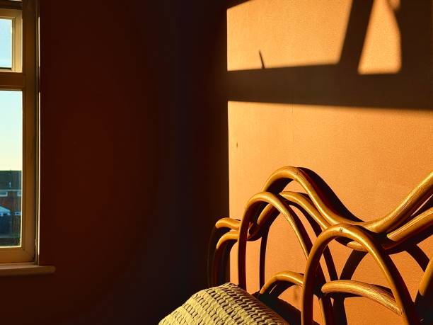 istock Late evening summer sunlight casting reflections in a domestic bedroom 2155679818