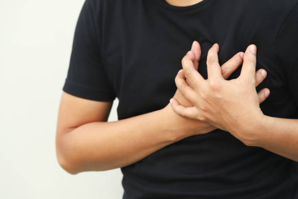 istock man having chest pain while exercising - heart attack. or Heavy exercise causes the body to shock heart disease. may cause life-threatening. health care concept. 2155680343