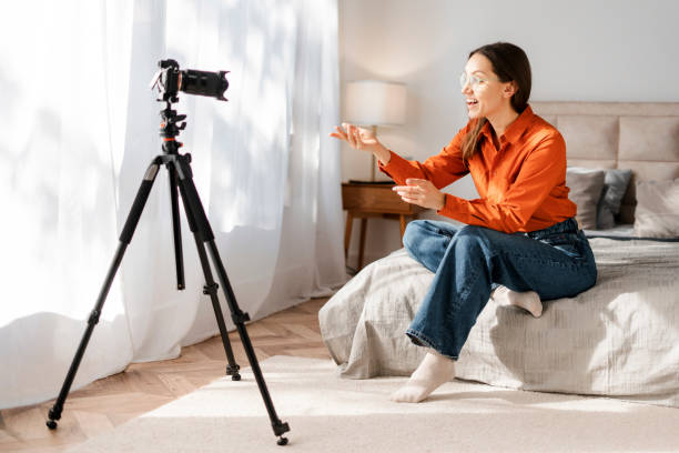 istock Positive happy student girl talking on video call, looking at camera, smiling, laughing 2155681640