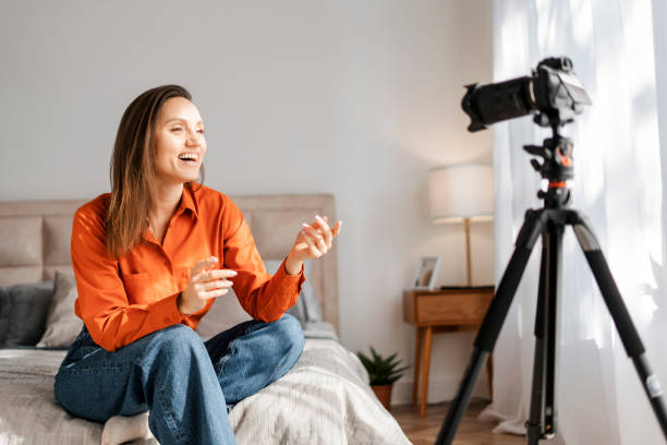 istock Happy cheerful young woman blogger making video content for sharing 2155681643