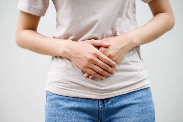 istock young woman with pain 2155682326
