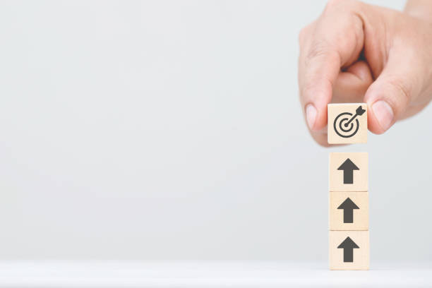 istock wood cube block target with Growing sales of online e-commerce products 2155682887