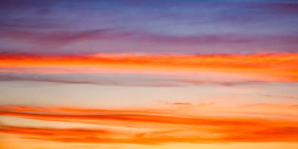 istock The sky ablaze with warm colors transitioning into cool tones, capturing natures artistry. Perfect for inspirational themes. 2155683000