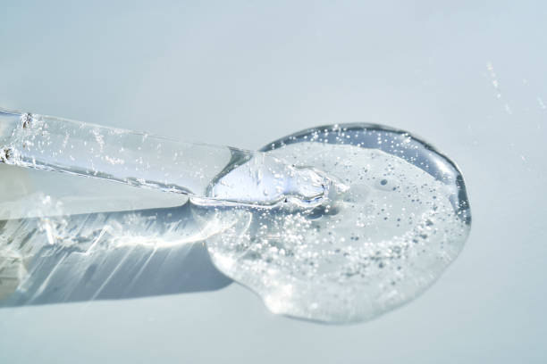 istock Pipette with serum shimmering in the sun on a blue background. 2155683198