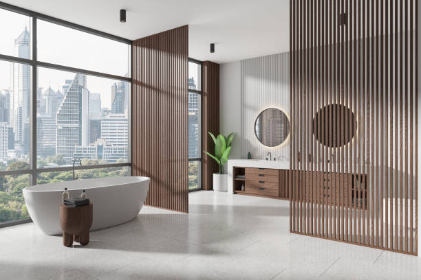 istock Modern home bathroom interior with tub, double sink and panoramic window 2155684622