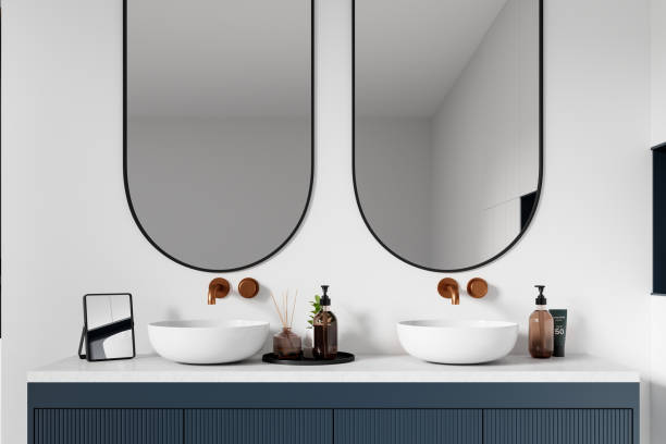 istock Stylish hotel bathroom interior with double sink and accessories on vanity 2155684754